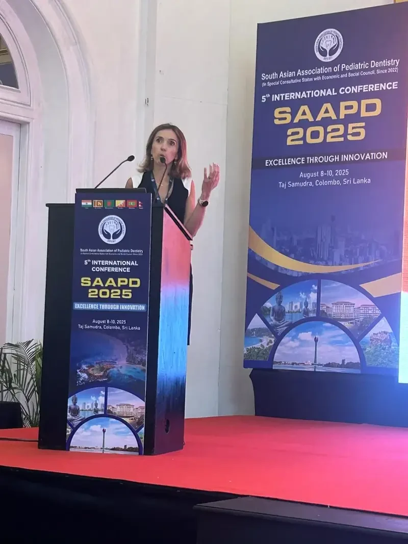 Dr. Camila Di Giorgio delivering an international keynote on special care dentistry